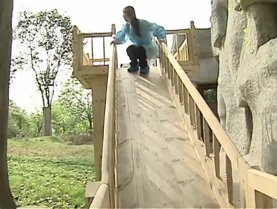 Cute pandas playing on the slide