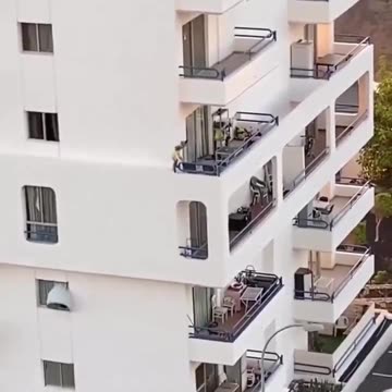 Kid walking on the edge of a building. Parents nowhere to be seen