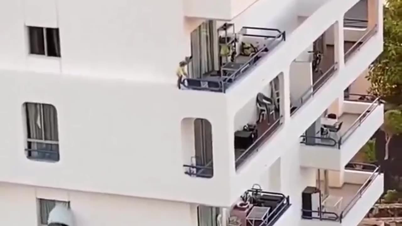 Kid walking on the edge of a building. Parents nowhere to be seen