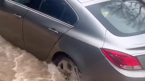 Vehicles passing through flooded areas