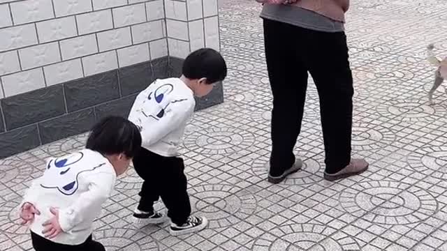 Two cute little girls walking like grandpa