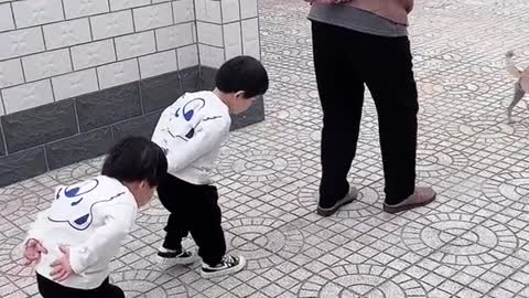 Two cute little girls walking like grandpa