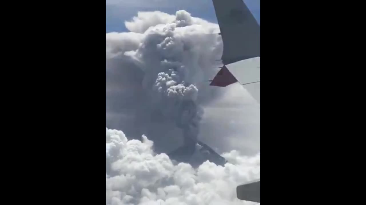 Airline Passenger captures eruption of an old world building (aka Volcano)