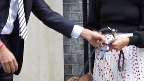 Prime Minister Rishi Sunak and his wife buy poppies outside 10 Downing Street