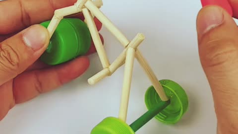 Make a bicycle using bottle caps