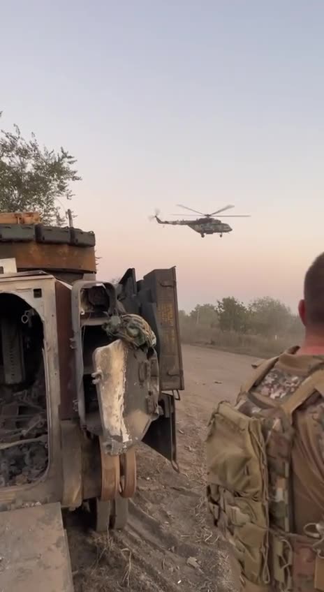 Ukrainian Mi-17 V-5 flies near destroyed Bradley M2A2 ODS-SA