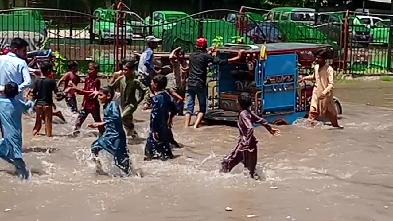 Children enjoying in the rain