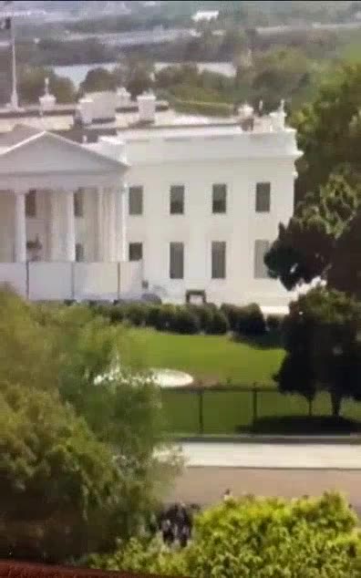 2 Men Carrying What Looks Like a Casket Into The WhiteHouse?