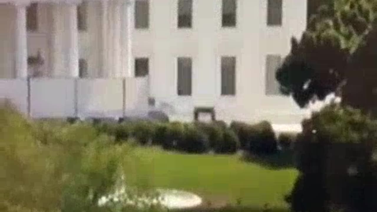 2 Men Carrying What Looks Like a Casket Into The WhiteHouse?