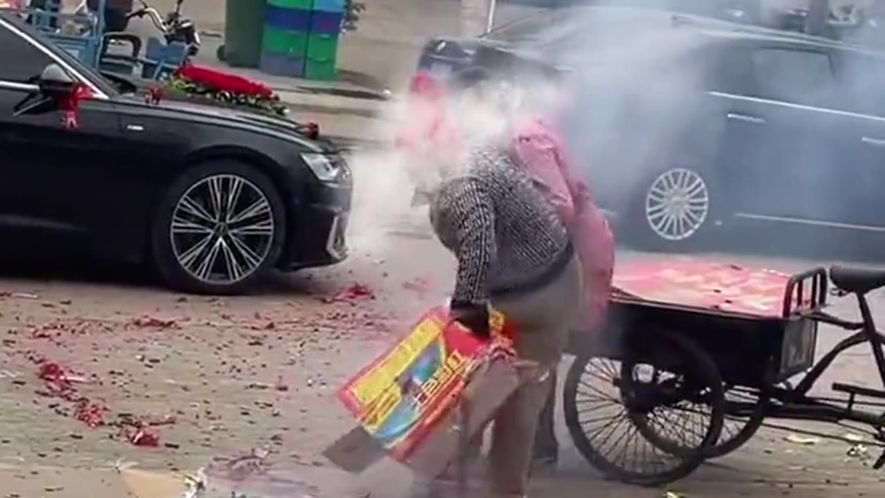 Two women fighting over a cardboard box