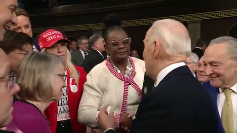 EPIC! MTG Hands Joe Biden a Button Reading "Laken Riley" as He Enters Chamber to Deliver SOTU