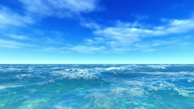 Flying over the bright blue open ocean