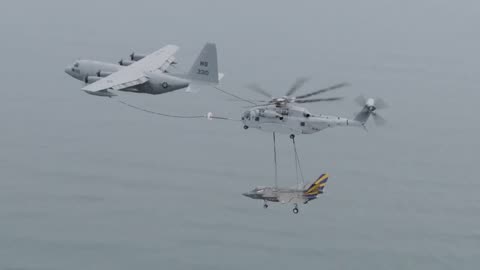 American Helicopter Mid Air Refueling While Transporting an F35