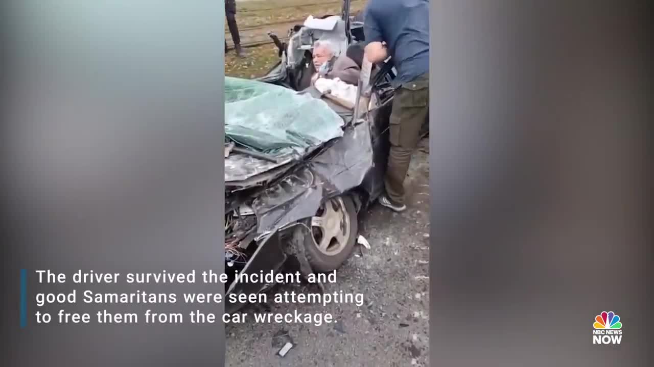 WATCH: Ukrainians Try To Pull Driver From Wreckage After Military Vehicle Runs Over Car