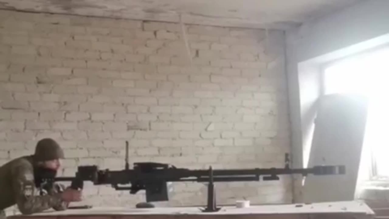 Ukranian soldier fires at Russian positions from a massive Kord heavy machine gun