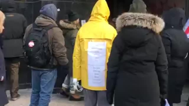 Toronto public health people standing outside demanding an end to the medical tyranny in Canada