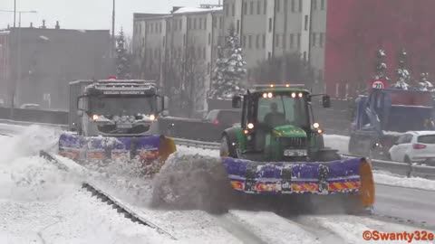 Snow Plows At Work During Heavy Snowfall
