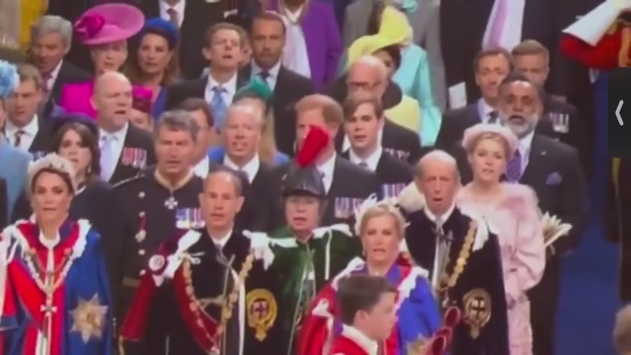 Prince Harry’s view is blocked by a feather. Lol