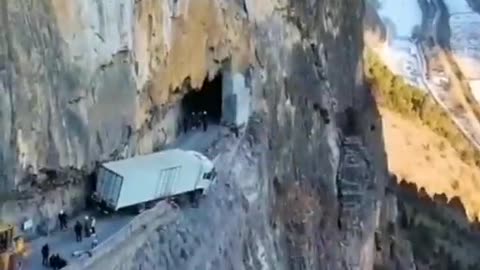 Truck hanging off a cliff