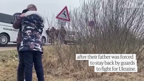 Ukrainian mother hugs her children brought to safety by a stranger