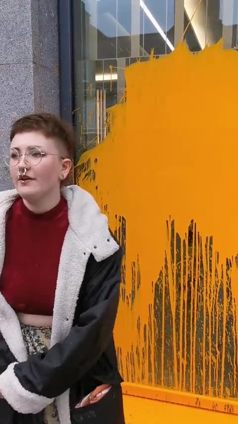 "Just Stop Oil" lunatic throwing paint on a bank in Aberdeen today