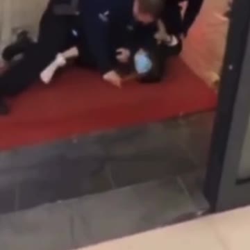 Belgium - Police officers forcibly put a mask on a 14 year old girl.