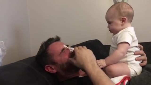 Baby throws up on dad