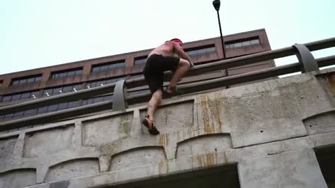 Man Climbs Onto Bridge Using Incredible Strength and Grip