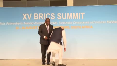 RESPECT for the National Flag 🫡 - PM Modi picks up the Tricolour during BRICS Summit 🇮🇳