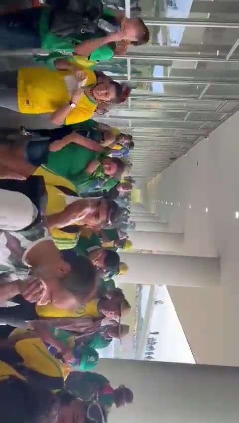 Protesters end up detaining a man suspected of carrying several bombs in his backpack.