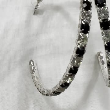 Silver Plated 2.75” x 2.5” Hoop Earrings. Made with Swarovski Crystal