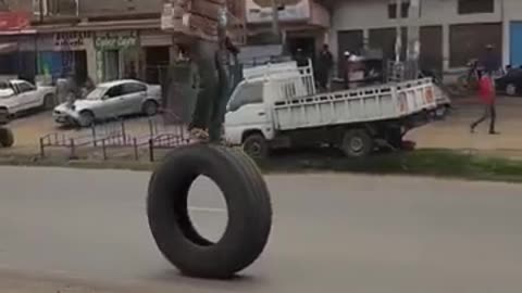 ridding on top of a moving tyre