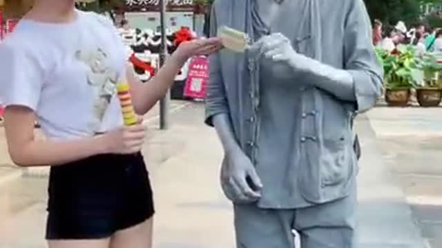 funny silver man with people