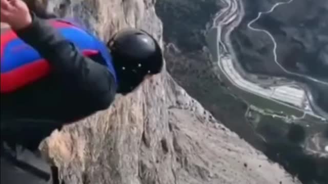 Man jumping off the cliff