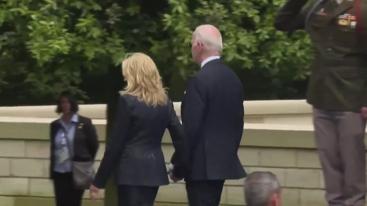 Jill, Ed.D., escorts Joe Biden out as French President Macron stays behind to greet veterans