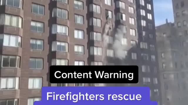 Firefighters rescue woman dangling from 20th-story window