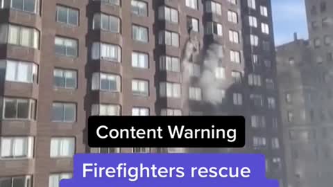 Firefighters rescue woman dangling from 20th-story window