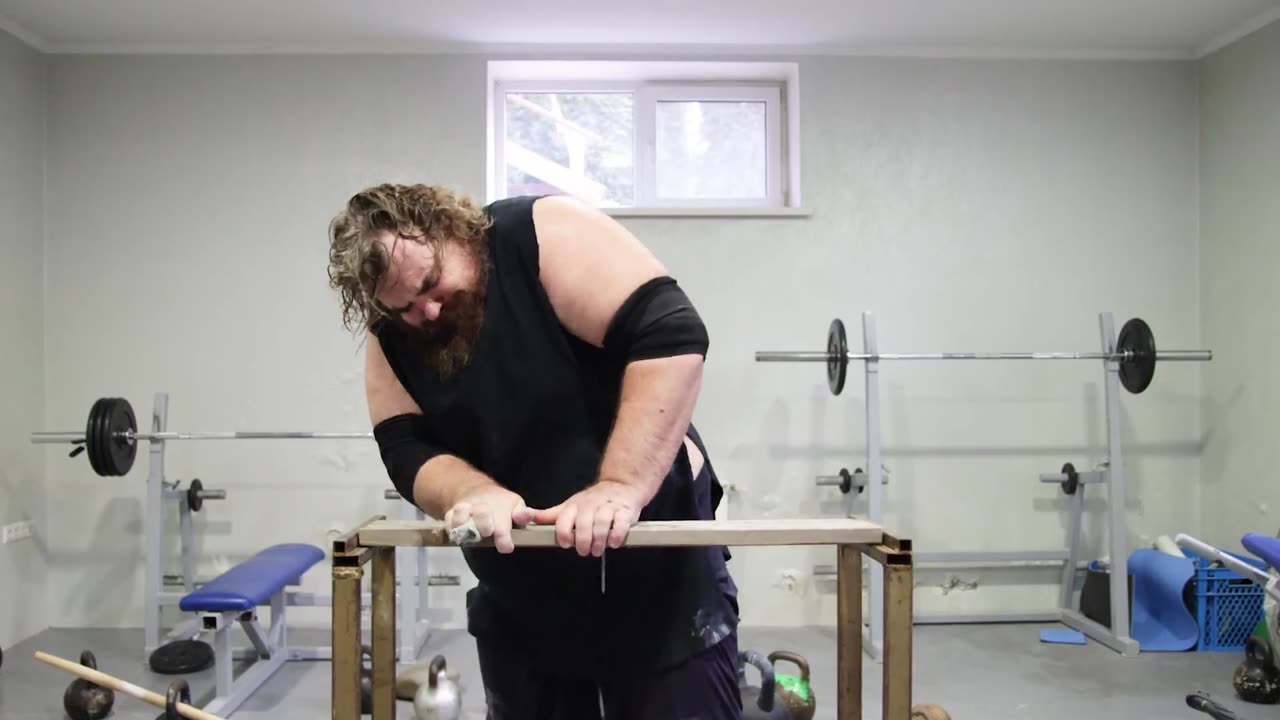 Karate Chopping A Board With Nails