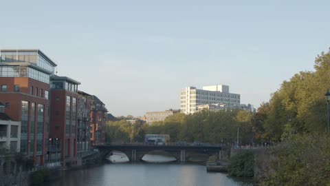 Wide Shot of People and Traffic On Bristol Bridge In Bristol England