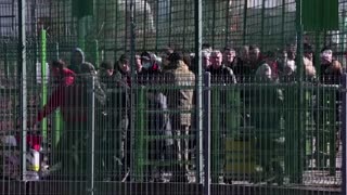 'It's hard to process': Ukrainians flee to Poland