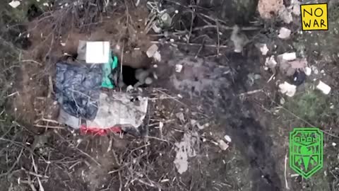 Russians resting on the roadside in Bakhmut , waiting for the drone