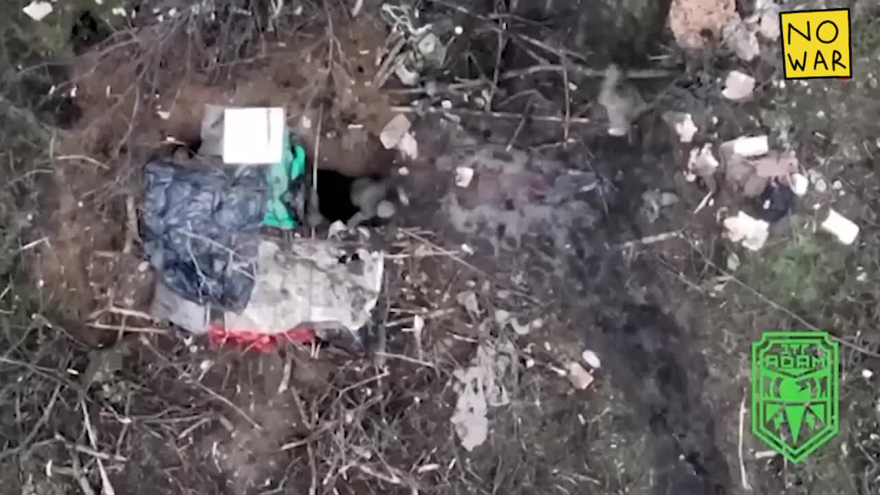 Russians resting on the roadside in Bakhmut , waiting for the drone