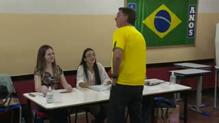 Brazil incumbent Bolsonaro votes in presidential election _ AFP