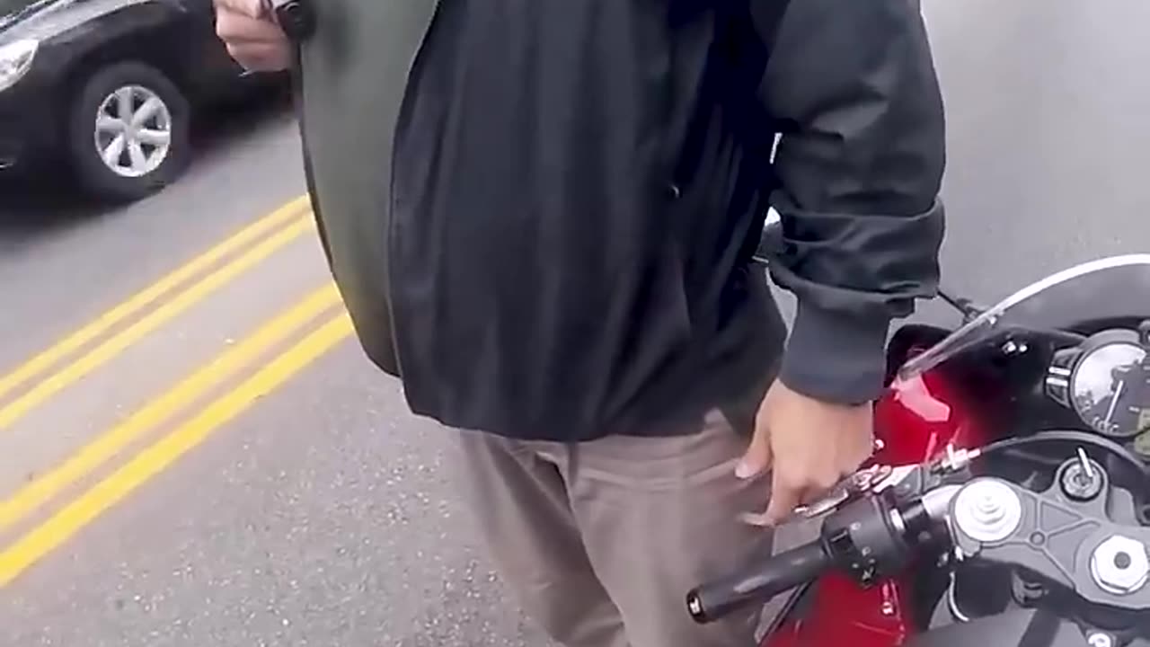 Cop Rolls Up On Biker With Gun Drawn