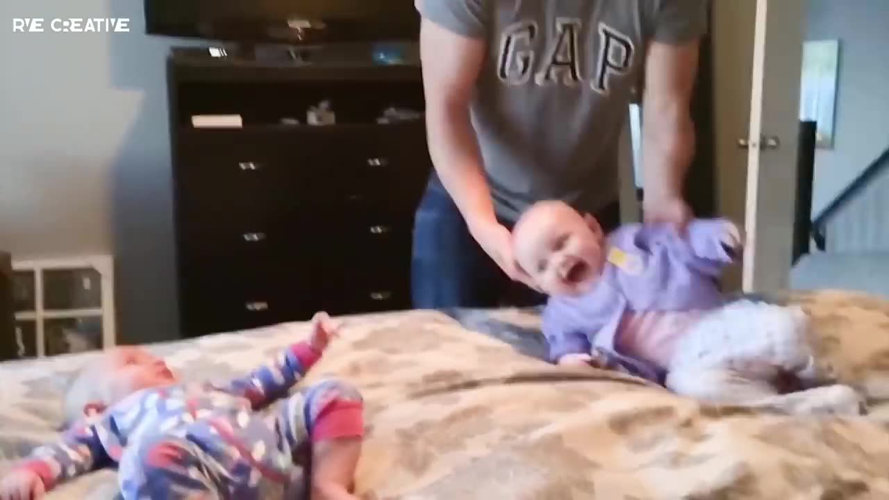 Cute Twin Babies Having a Fight