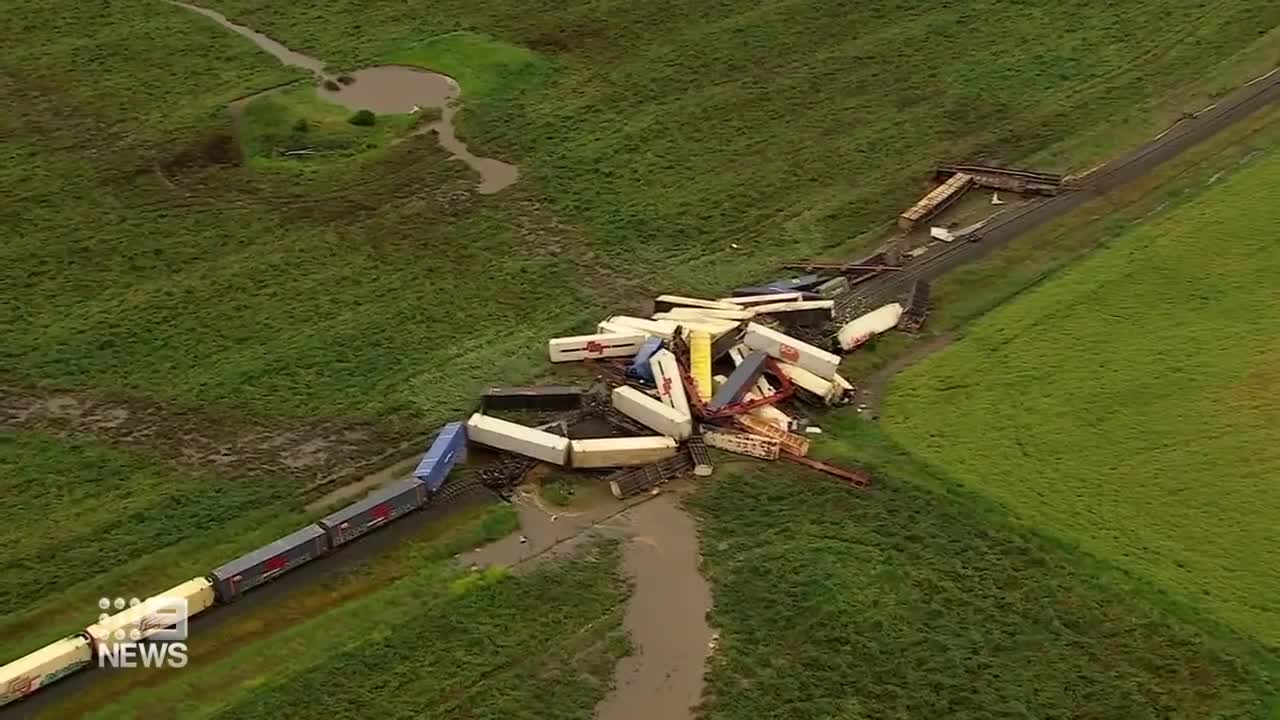 Freight train derails, causes tens of carriages piled up on tracks _ 9 News Australia