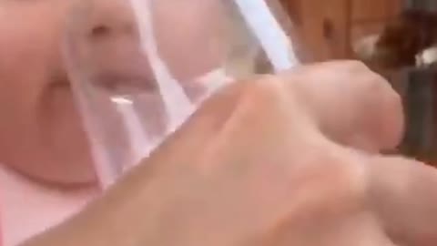 baby drinking water for the first time