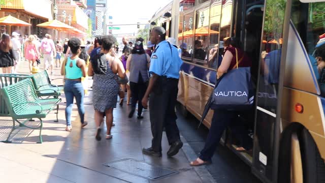 People getting in and out the bus on Las Vegas boulevard.