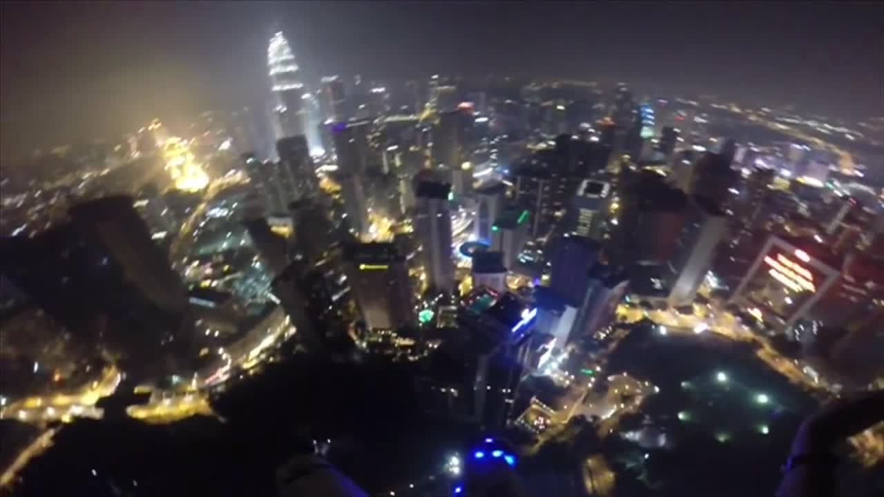 Base jumpers 'gatecrash' pool party in Kuala Lumpur