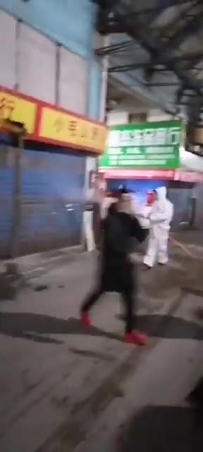 Crews decontaminate the wet market in Wuhan China